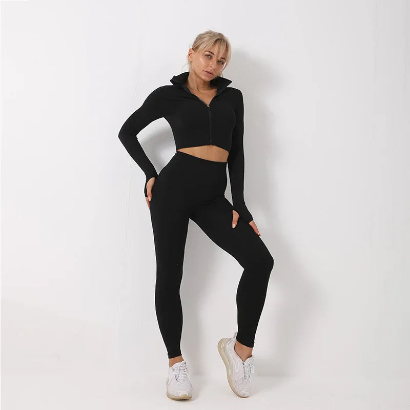 Woman wearing a black athletic outfit on a white background