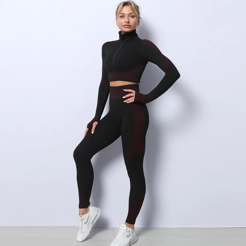 Woman wearing a black athletic outfit with white sneakers on a light gray background