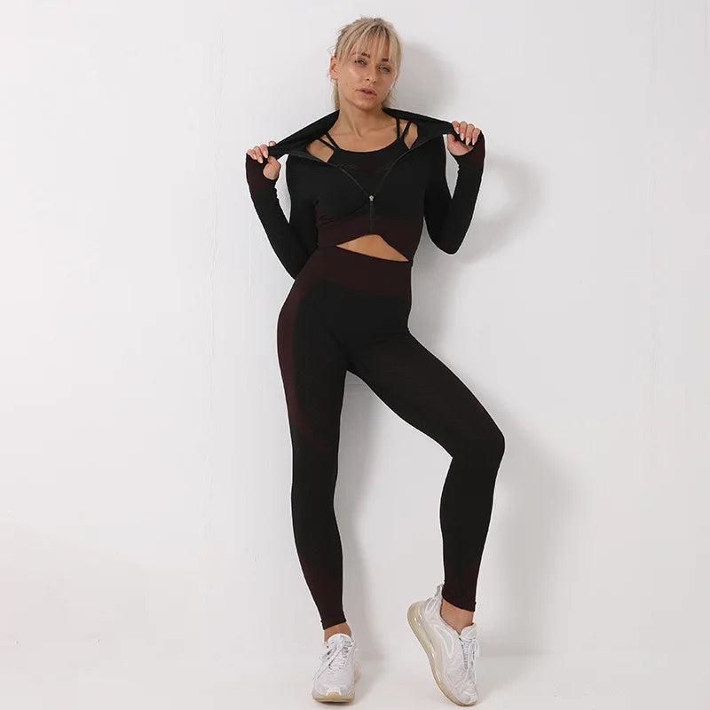 Woman wearing a black athletic outfit on a white background